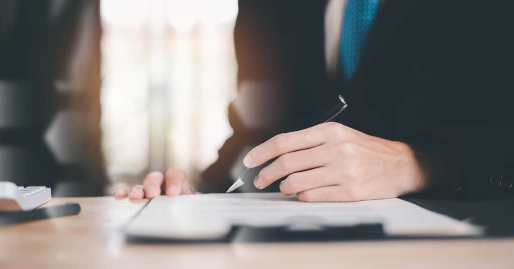 Florida homeowner reviewing a Quit Claim Deed with a St. Augustine real estate attorney